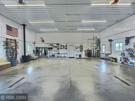 14 foot ceilings, floor drains and endless storage space are a dream with this barndominium.