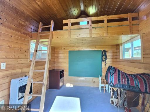Interior view of the bunkhouse warmed by an electric space heater. Really, how fun is this?
