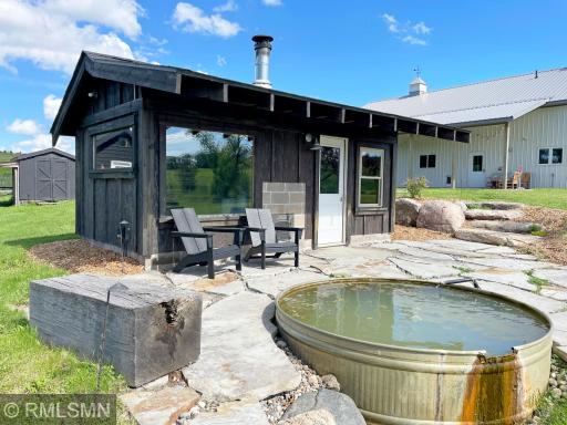 The sauna offers an outdoor patio with a freshwater soaking spa filled from an artesian well.