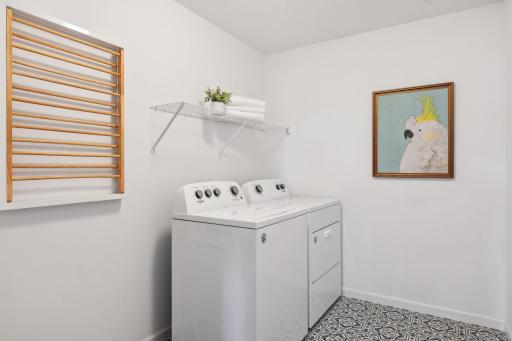 Large laundry room on the upper level allows for ease of doing laundry