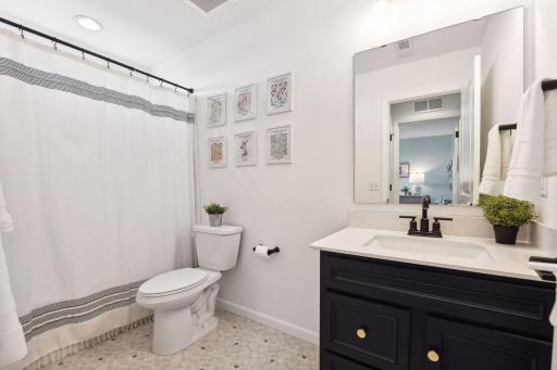 Super cute full bathroom on the upper level to service the two bedrooms