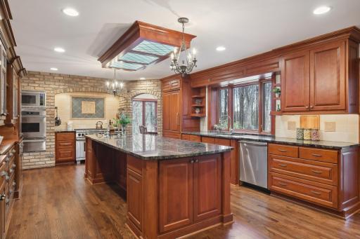 The professionally designed kitchen makes entertaining a few or many, a simple task. Features include high-end appliances, ample custom storage options, as well as an abundance of counter space for meal prep and serving.