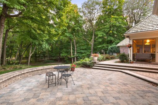 Recently re-laid and sealed, the paver patio offers multiple seating areas.