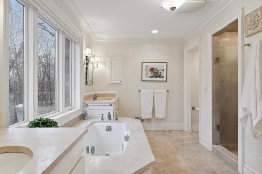 With heated travertine floors, dual vanities, jetted tub and separate shower, you'll look forward to getting ready in the morning or winding down at night.