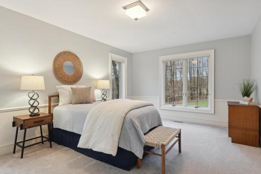 The third and fourth main level bedrooms offer views to the front and side of the home.