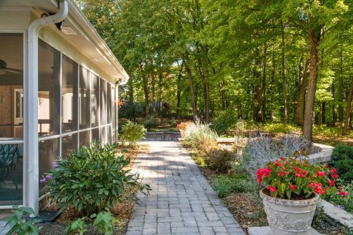 Picturesque perennial gardens surround the home.