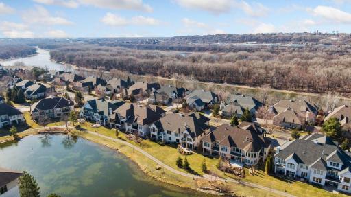 Set between the river bluff and a peaceful pond
