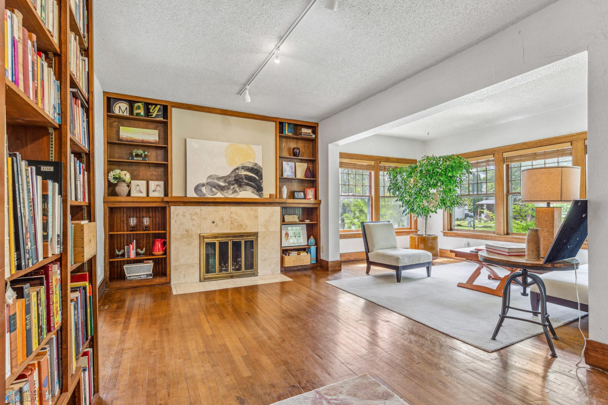 Living Room with beautiful, fully working wood fireplace