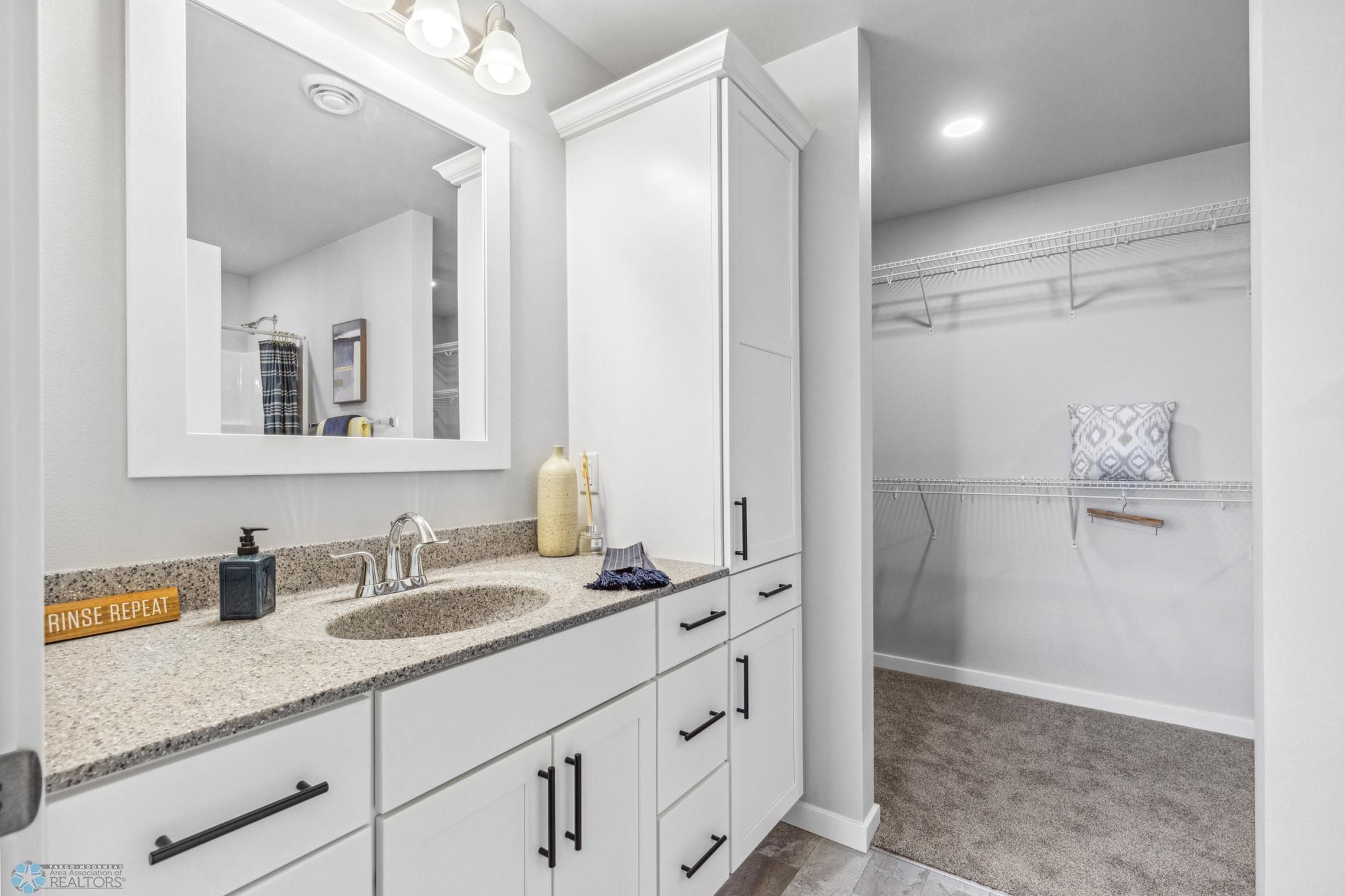 Spacious Primary Bathroom with walk-in shower and huge primary closet.