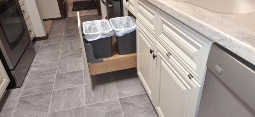 Pull out drawers in the lower cabinets and pull out garbage and recycling.