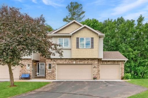 Meticulously maintained end unit town home with a 3 car garage!