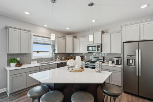 (Photo of decorated model, finishes will vary) Welcome to Talamore! Modern and functional, the kitchen is sure to impress!