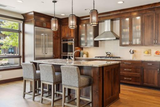 Large center island, granite tops, SS appliances, gas cooktop, double ovens, plenty of cabinet space and lots of natural light are highlights of this beautiful space