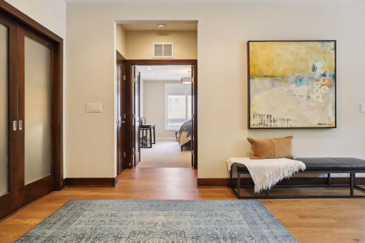 A grand foyer leads to the private primary suite