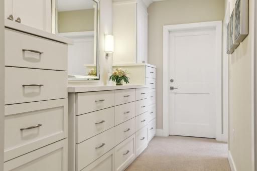A walk through dressing area leads the way to two walk-in closets