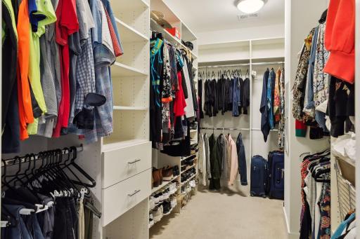 Two spacious walk-in closets with built-in organizational components