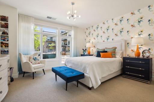 Secondary bedroom is equally as spacious, plus offers access to outdoor patio