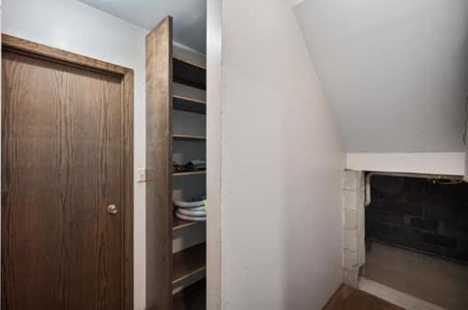 Closet off bedroom in lower level and crawl space under stairs for storage.