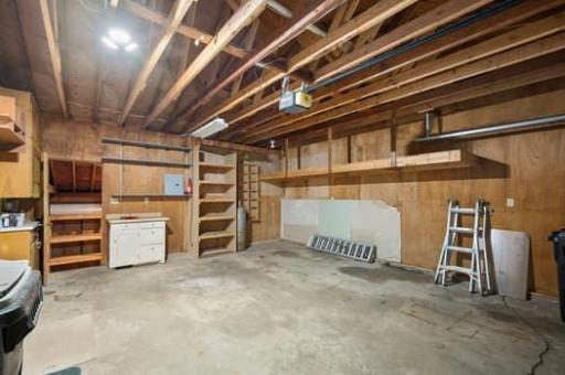 Large 2 car garage with build in shelves.