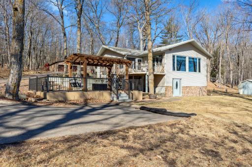 200'of level Shoreline on crystal clear Eagle Lake, 6 acre lot with mature treeas, level grounds at lakeside perfect for yardgames and gatherings, Vaulted T & G Ceilings, stone fireplace,3 car heated & insulated garage and a 32x40 polebarn!