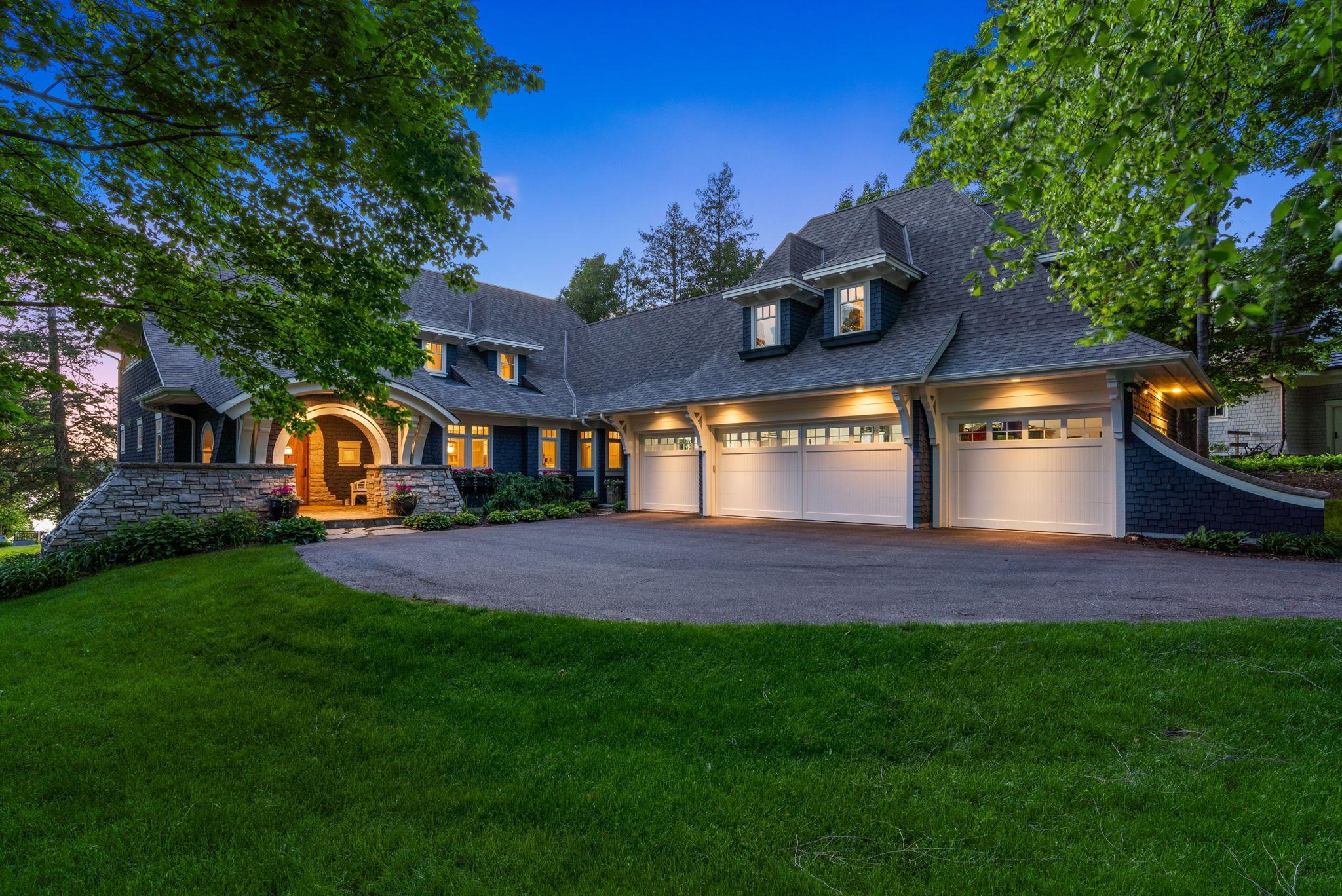 Heated four car garage with epoxy floors and a dog wash station.