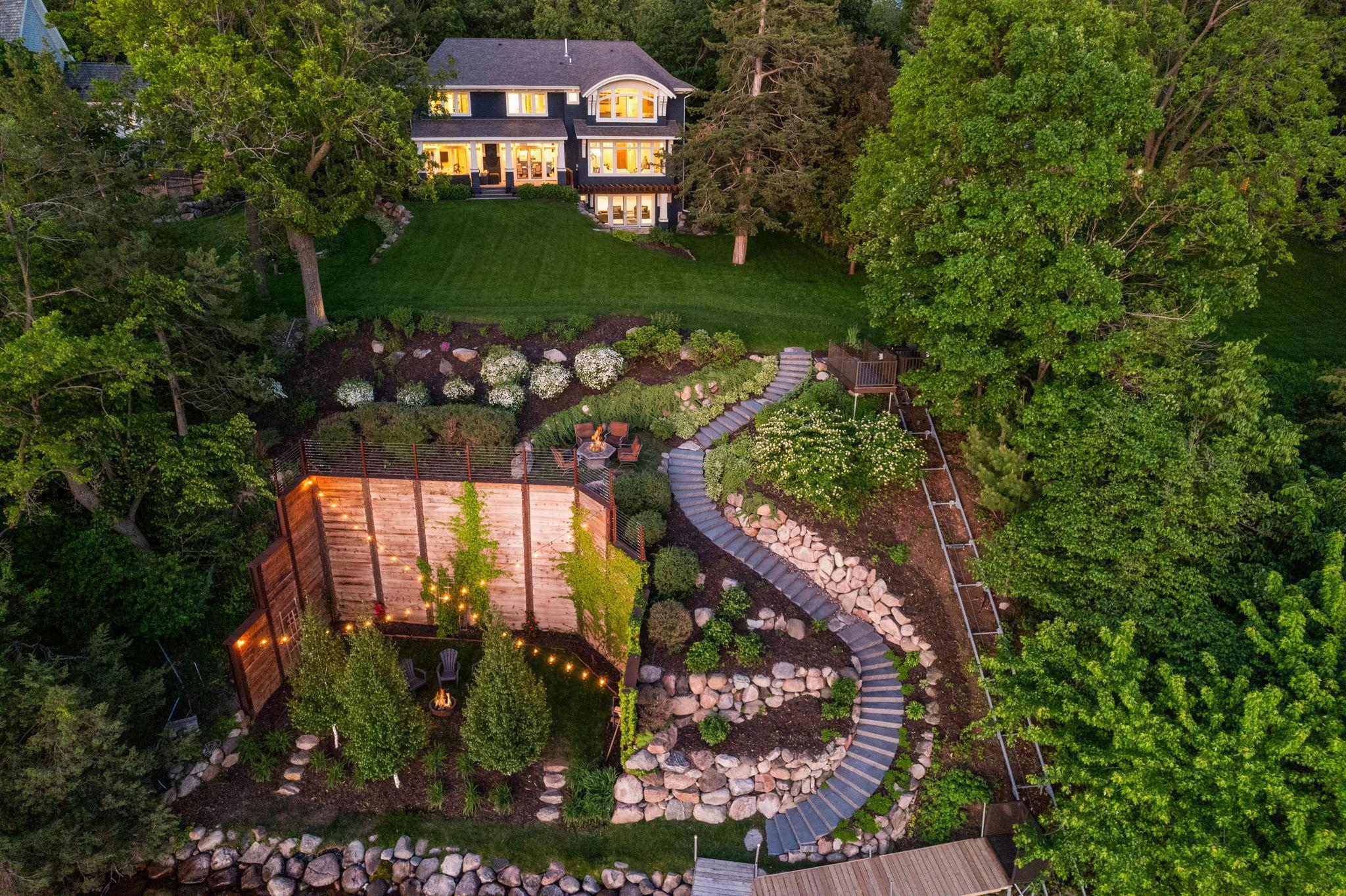 Custom landscaping with mulitple ways to the lake including a motorized tram.