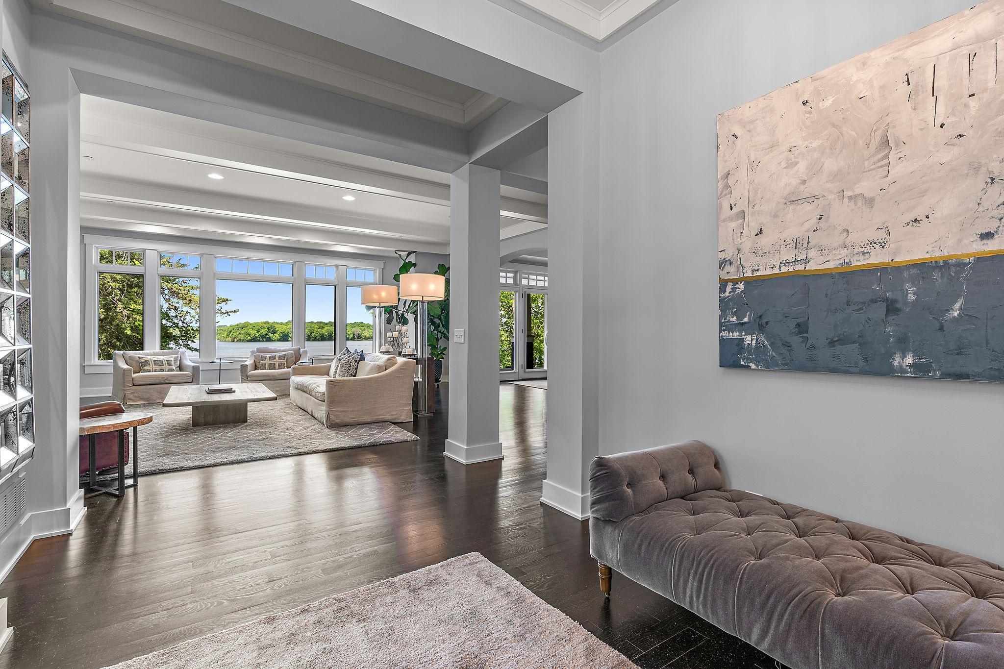 Gleaming hardwood floors throughout the main level with stunning beams and woodwork.