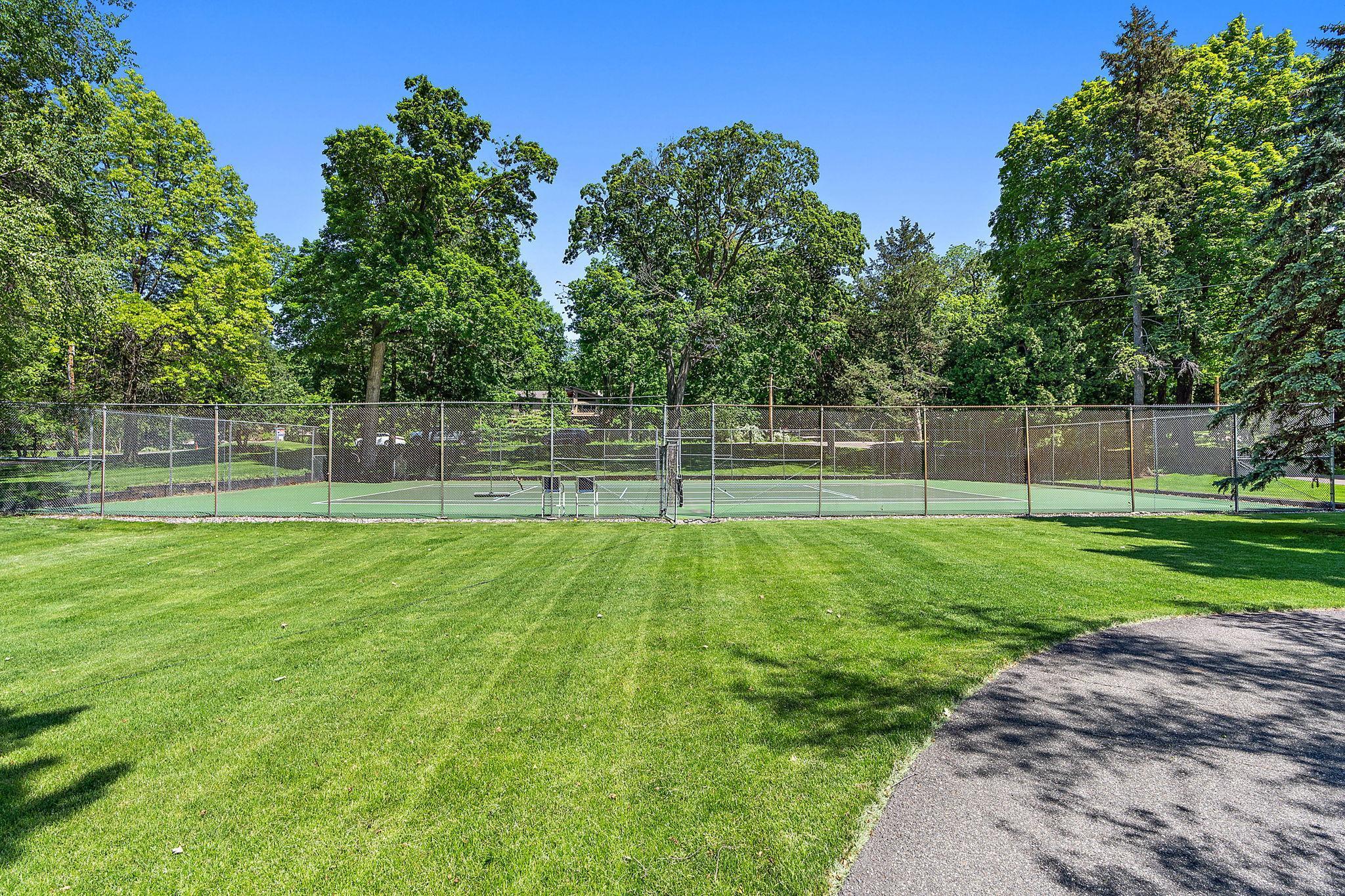 Enjoy the tennis/pickle ball court in the front yard for endless competitions!