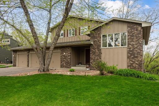 Beautiful multi-level home in a gorgeous setting with over 150' of Mississippi River frontage and in a wonderful location!
