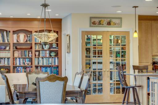 The panty is stunning focal point in the kitchen with glass french doors and accent lighting.