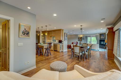 Host friends and family with ease in the adjoining dining area, where conversations flow effortlessly amidst the harmonious ambiance created by the surround sound system.