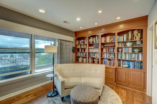 Cherry built-in bookcase for your own library wall. Cozy corner to cuddle up and read a book.