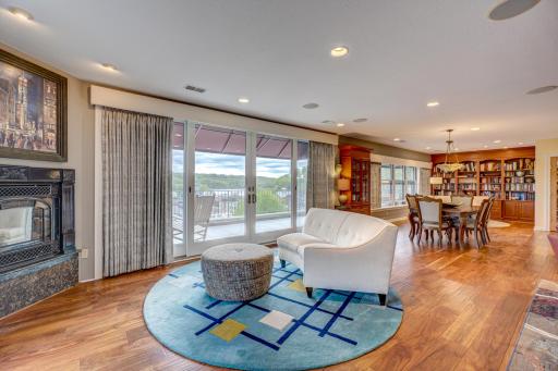 As you enter, you're immediately drawn to the expansive living space, bathed in sunlight streaming through a magnificent wall of windows. This architectural masterpiece creating a seamless connection between indoor and outdoor living.