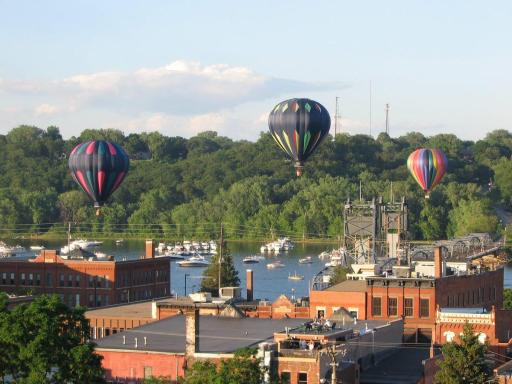 Birds Eye View of Hot Air Balloons passing through as seen from veranda