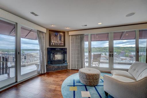 Experience the magic of living in a home adorned with a captivating wall of windows enjoying the vivid colors of nature while nestle infront of the corner gas fireplace with Granite apron.