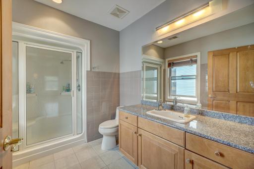 2nd Bedroom Private 3/4 Bath features one piece shower stall, silestone counter tops and tile floors.