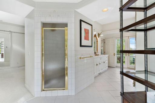 Separate tub and walk-in shower in the owner's suite.