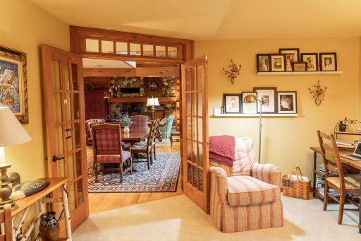 Cozy up in the library off the dining room and primary bedroom