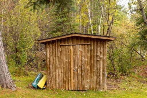 Storage shed near lake to hold water toys