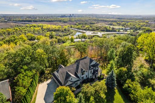 Overlooking the beautiful Minnesota River Valley and nestled in a grove of mature trees, this home offers spectacular views and amazing privacy!