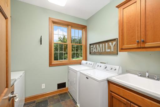 A spacious laundry room is just off the fantastic mud room leading to the 4 car heated garage.