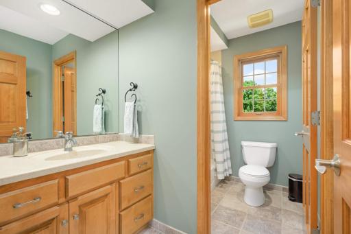 A full bath in the hall services two of the four upper level bedrooms