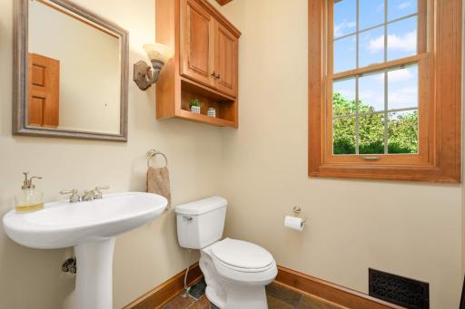 The powder room is centrally located for easy access from anywhere on the main level.