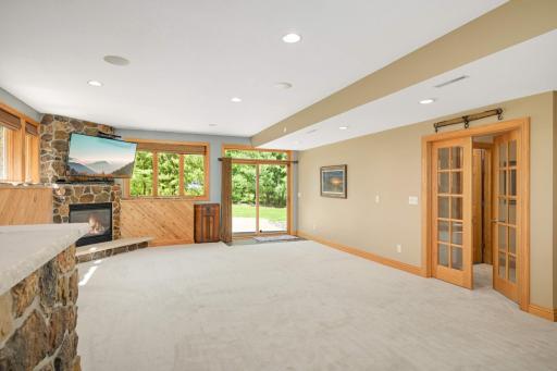 The lower level features the second gas fireplace within the home.