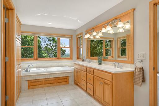 The primary bath features double vanities, large soaking tub, separate walk in shower and huge walk in closet.