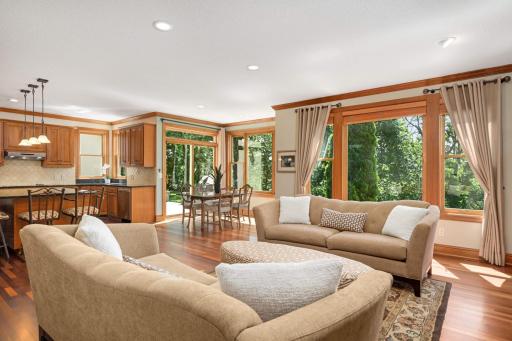 Nine foot ceilings, walls of windows and open concept frame this grand space.