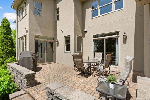 This amazing outdoor space is accessible from both the great room and cozy den.