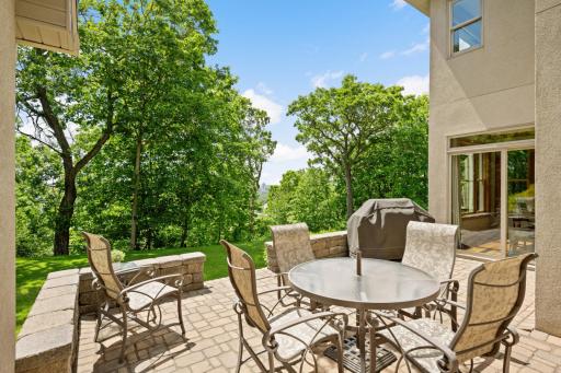 Enjoy easy kitchen access to this 21 x 15 foot stone patio. What a perfect outdoor entertainment space.