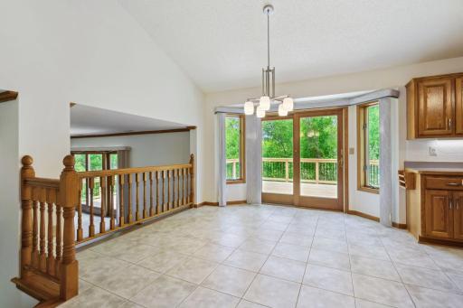 Dining/eat-in kitchen area with access to the deck and great views of the private back yard