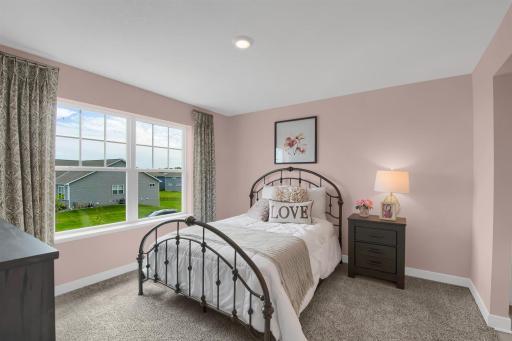 The additional upper level bedrooms are spacious and have their own walk in closets! Model photos. Options and colors will vary.